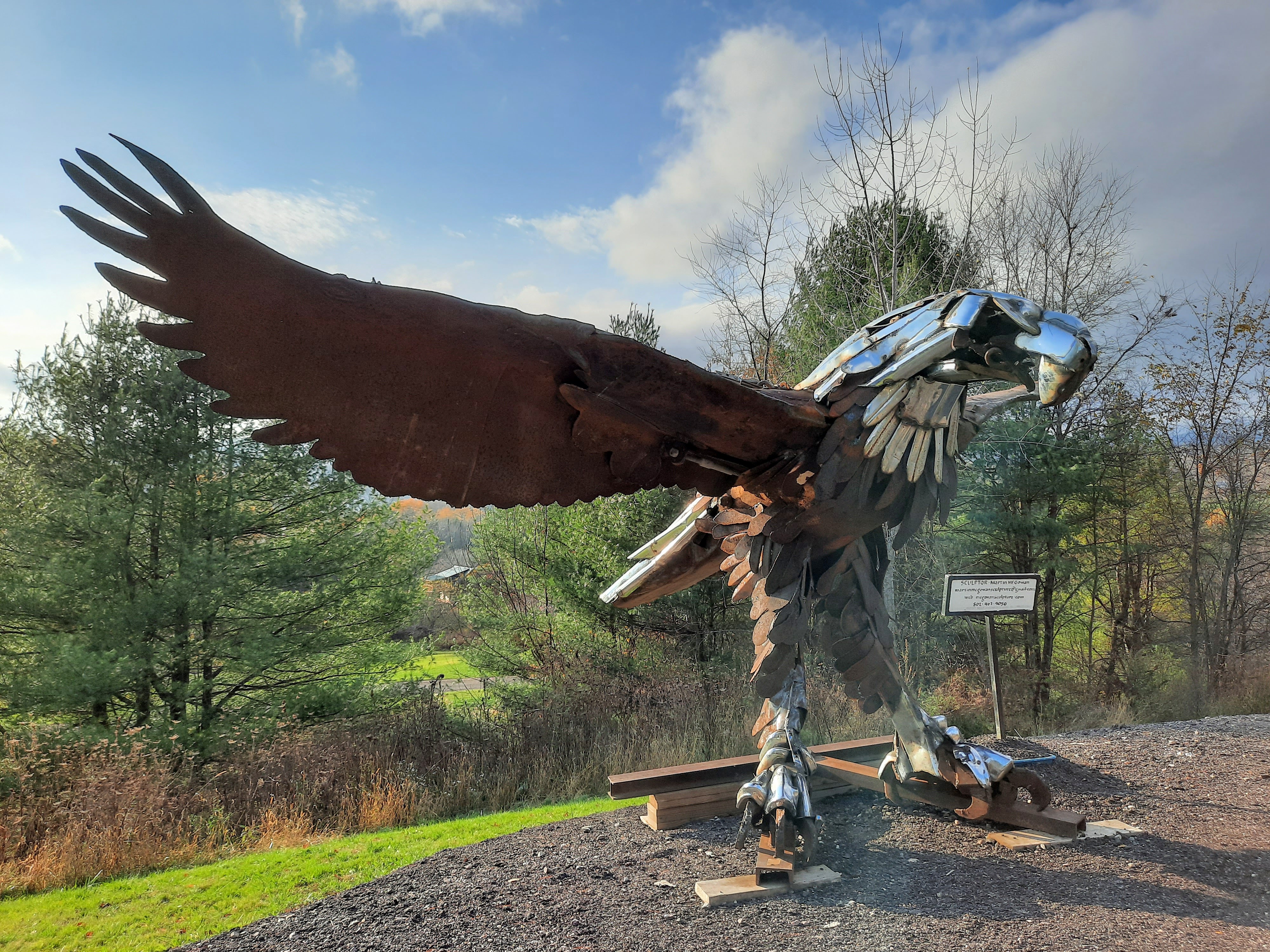 A chrome eagle sculpture along Route 100